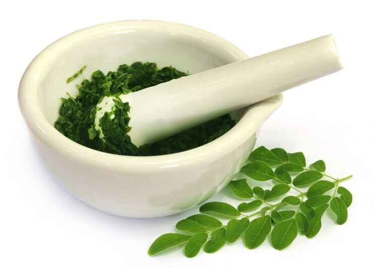 moringa-leaves-with-mortar-pestle ayurveda crusher