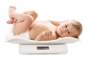 weighing-little-boy-diaper- baby weight